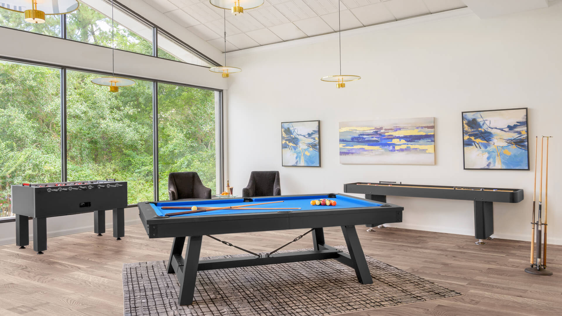 Black pool table with blue felt