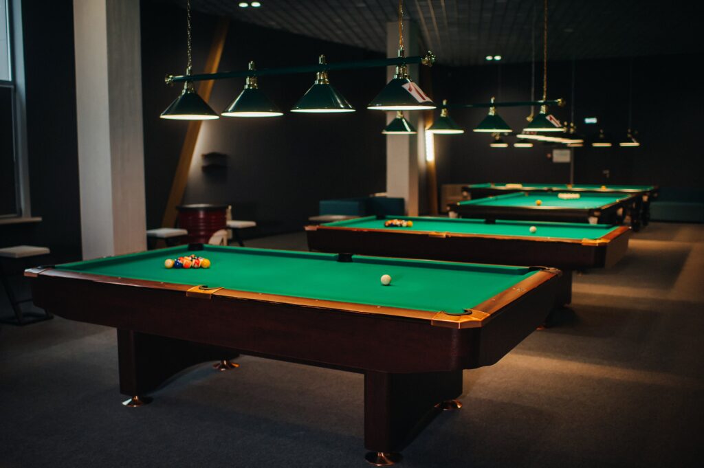 billiard-table-with-green-surface-and-balls-in-the-2021-09-03-23-23-16-utc-min Billiard table with green surface and balls